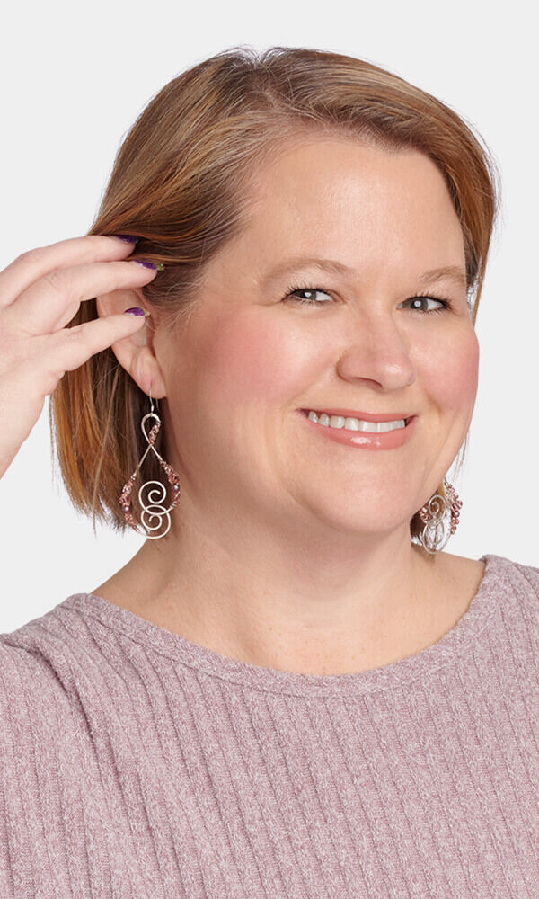 Model showing off wire wrapped earrings